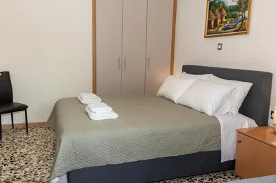 a bedroom with a bed with towels on it at Lumea Apartment in Chania Town