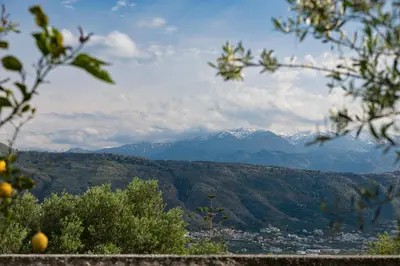 a view of a mountain range with mountains in the distance at Chania Garden Retreat in Souda