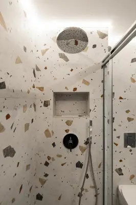 a room with a rock wall with a hole at Paradise for Couples, Next to Soothing Waves in Galatás