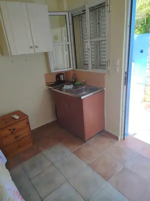 a kitchen with a sink and a counter top at Stefanos Garden2 in Arménoi