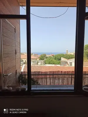 a view from a window of a building at Cozy Room wtih Amazing Sea View of the Old Harbour in Chania Town