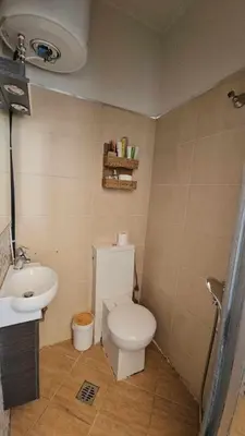 a bathroom with a toilet and a sink at Cozy Room wtih Amazing Sea View of the Old Harbour in Chania Town