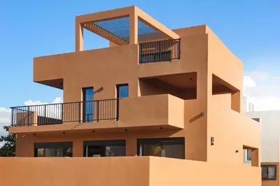 a building with a balcony on top of it at Madre Tierra Boutique Villa 1 in Liyidhés