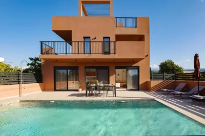 a house with a swimming pool in front of a house at Madre Tierra Boutique Villa 1 in Liyidhés