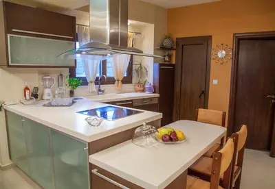 a kitchen with a bowl of fruit on a counter at Villa Veghera in Kissamos