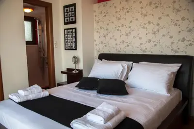 a bedroom with a large bed with towels on it at Villa Veghera in Kissamos