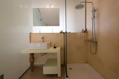 a bathroom with a sink and a shower at Libyan Mare in Palaiochóra