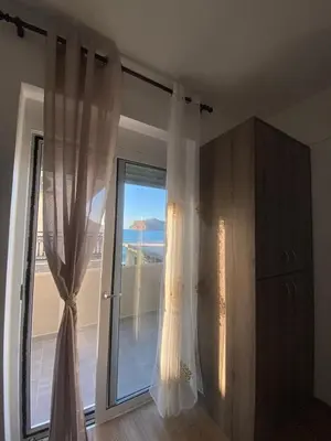 a room with a sliding glass door with a window at Tile Apartments 5 in Agia Marina Nea Kydonias