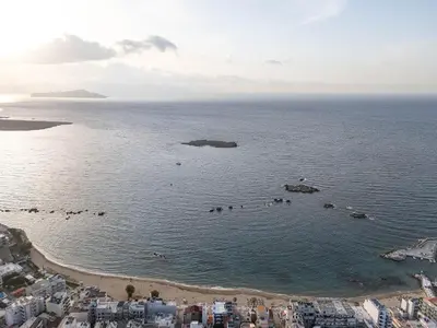 an aerial view of a beach in the ocean at Neachora Beachfront Suites in Chania Town