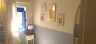 a room with a hallway with a window and a lamp at Sfakia On the Beach in Khóra Sfakíon