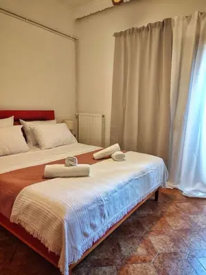 a bedroom with two beds with towels on them at La Casa di Teta by superhosthub in Galatás