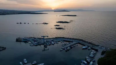 an aerial view of a marina with boats in the water at EdgeWater Beach Hotel in Chania Town