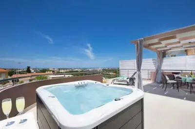 a bath tub sitting on top of a balcony at Angela Home, 5Street, Perivolia in Perivólia