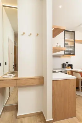 a kitchen with white walls and wooden counters at Kydoni Signature Apartment in Chania Town
