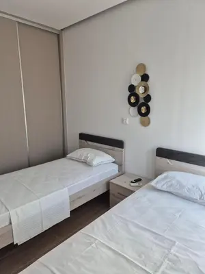 two beds in a room with two beds sidx sidx sidx at Aldea Apartments in Módhion