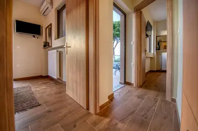 a hallway with wooden flooring in a house at Earthly Paradise in Kissamos
