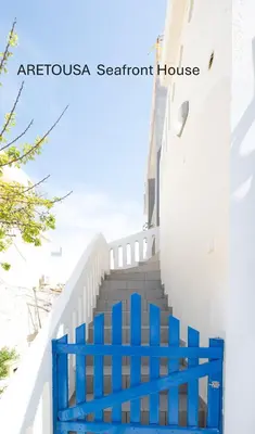a blue staircase in a santorini beach house at ARETOUSA Seafront House in Kalyves