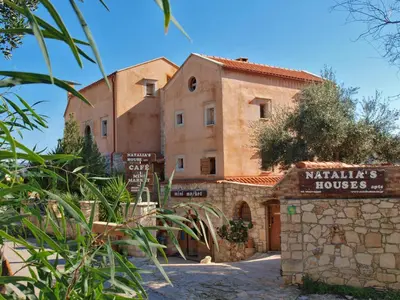 a building with a sign in front of it at Natalia's Houses in Chania Town
