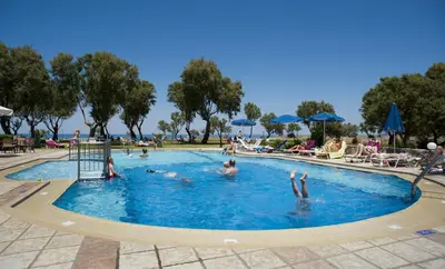a group of people swimming in a swimming pool at Lito Beach Hotel in Gerani Chanion