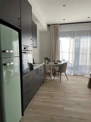 a kitchen with a table and a dining room at Casa Nero in Chania Town