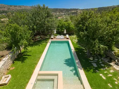 an overhead view of a swimming pool in a yard with trees at Villa Athermigo in Gavalochori