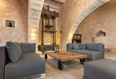 a living room with two couches and a coffee table at Villa Athermigo in Gavalochori