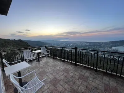 a balcony with a table and chairs and a view at Viewphoria in Maláxa