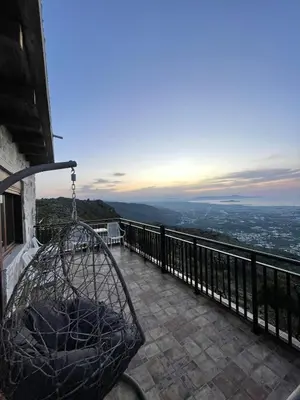 a balcony of a building with a view of the city at Viewphoria in Maláxa