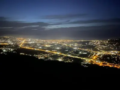 a view of a city lit up at night at Viewphoria in Maláxa