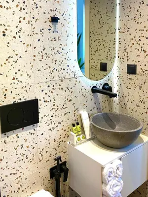 a bathroom with a sink and a mirror at Eftihia Studios Paleochora in Palaiochóra