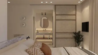 a bedroom with a white bed and a mirror at Eftihia Studios Paleochora in Palaiochóra