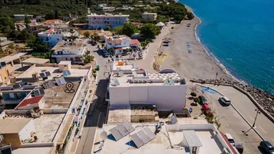 an aerial view of a town next to the ocean at Eftihia Studios Paleochora in Palaiochóra
