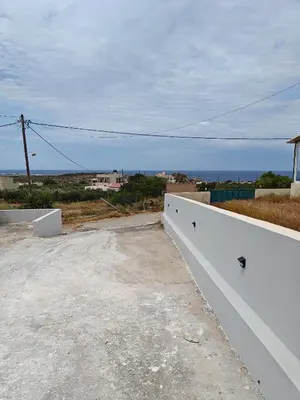 a view of the ocean from the roof of a house at Chrissos apartment in Agios Padeleimon