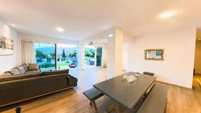 a living room with a couch and a table at MG Residence Boutique Holiday Home in Korakiaí