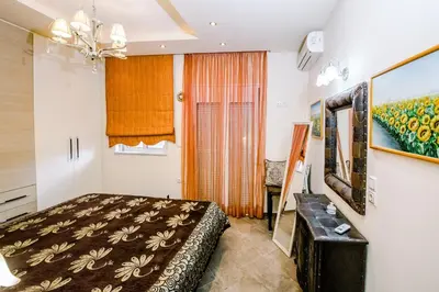 a bedroom with a bed and a painting on the wall at Mary's modern apartment in Kissamos