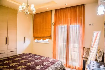 a bedroom with a bed and a window at Mary's modern apartment in Kissamos