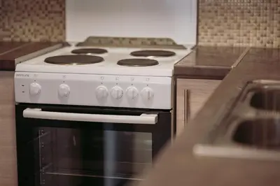a white stove top oven in a kitchen at Semeli House in Chania Town