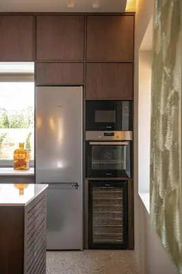 a kitchen with a stainless steel refrigerator and oven at Villa Portokalea in Maleme