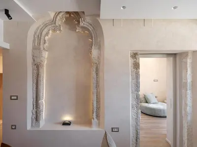 a living room with a large mirror on the wall at Venetian Harbour Residence in Chania Town