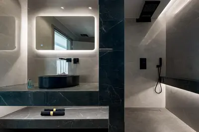 a bathroom with a sink and a mirror at Luxurious Villas Rocca Blanco 1 & 2 in Kounoupidhianá