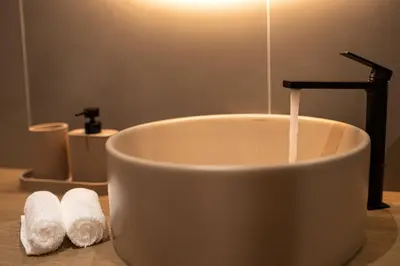 a white bath tub with a faucet in a bathroom at Madonna del Mare City in Chania Town