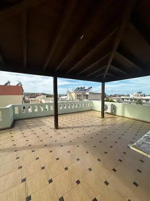 a large roof with a tile floor on top of a building at Sea View appartment in Chania Town