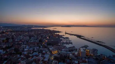 an aerial view of a city at sunset at Happy House-Steps from Nea Chora Beach in Chania Town
