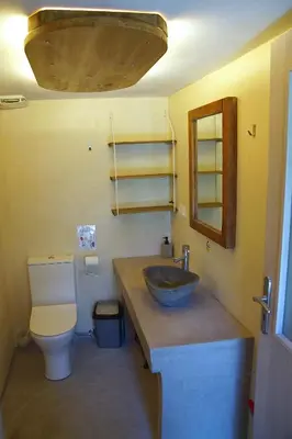a bathroom with a sink and a toilet at The Village Hideaway - Traditional Stone House in Kissamos