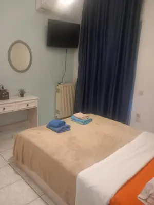 a bedroom with a bed with two towels on it at Emmanouil in Chania Town