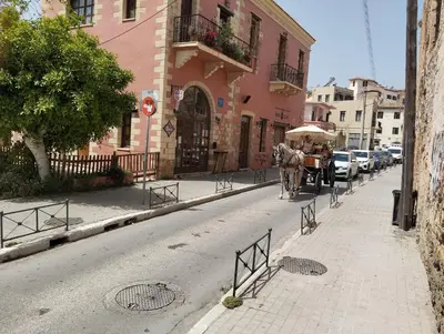 a horse drawn carriage on a city street at Lili House in Chania Town