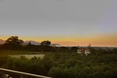 a view of the sunset from the balcony of a house at Solena in Tsikalariá