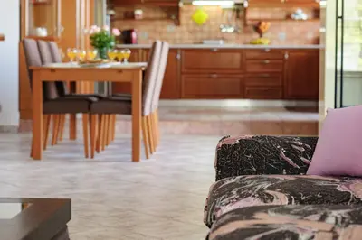 a living room with a couch and a table with a laptop at Solena in Tsikalariá