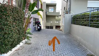 a motorcycle parked on a brick alley with an orange arrow at Καλαίσθητο Ηλιόλουστο Studio in Chania Town