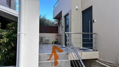 an orange painting on the side of a building at Καλαίσθητο Ηλιόλουστο Studio in Chania Town